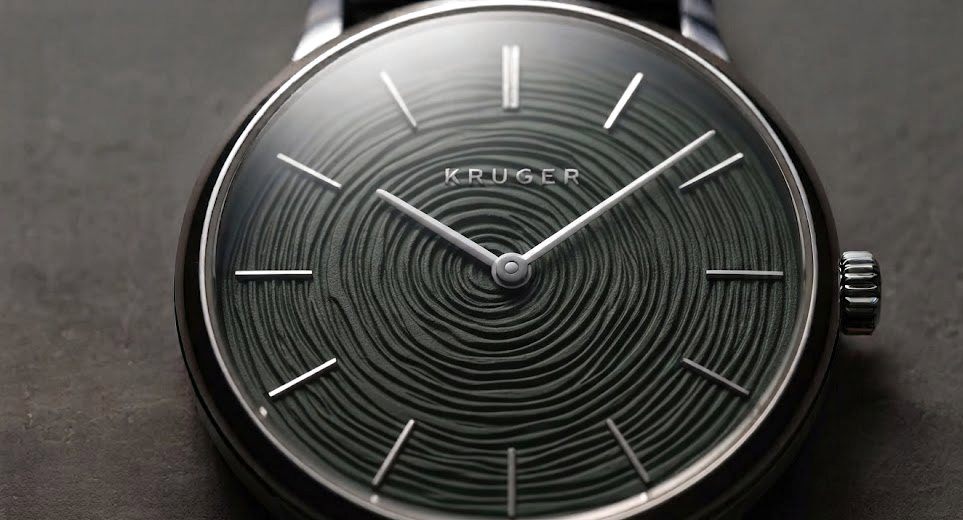 Near-black green dial carrying growth rings